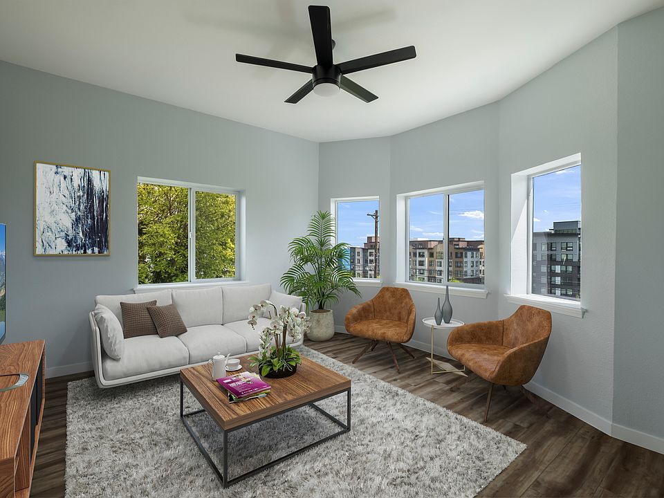 Living Room with high ceilings, bay windows, natural light.