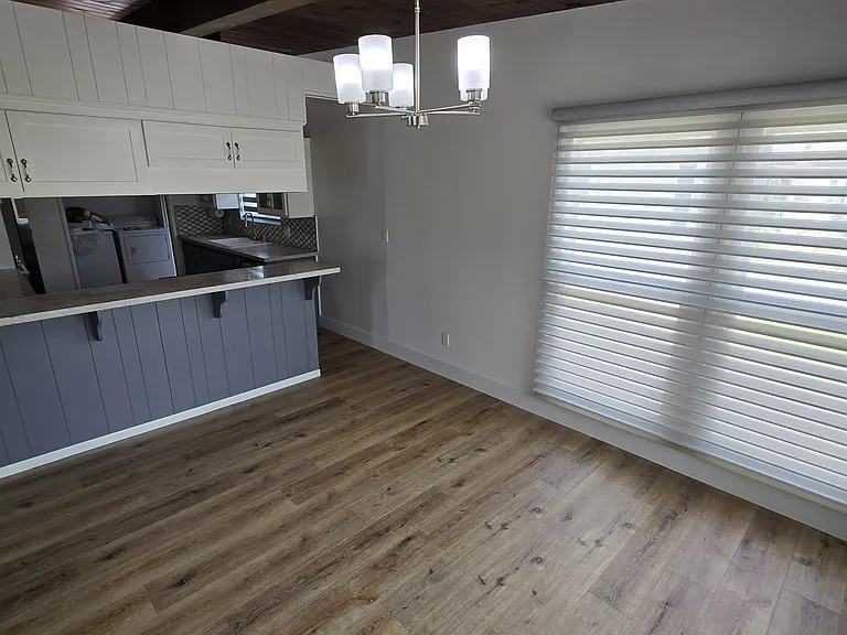 Dining Room adjacent to kitchen with with breakfast counter
