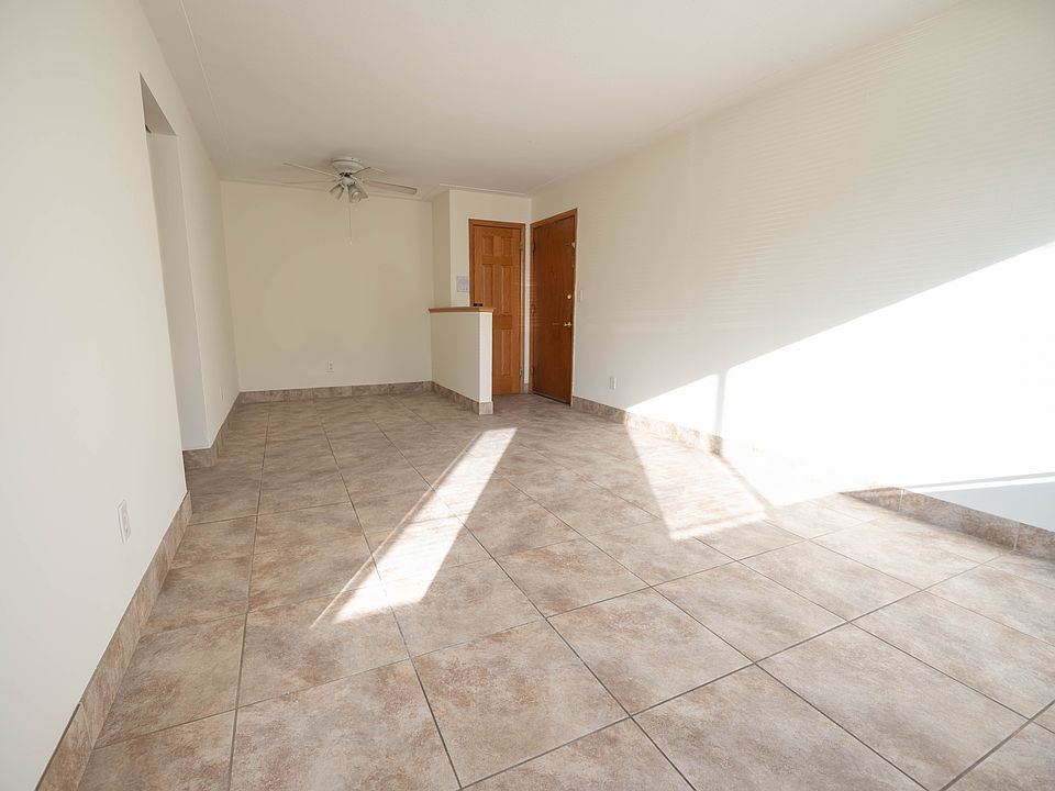 View of living room, entrance, and closet.