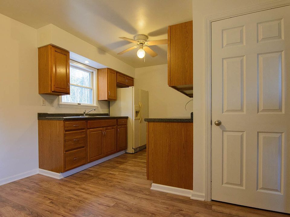 Kitchen. Door leads down to full, unfinished basement.