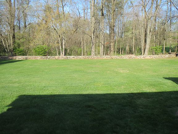 backyard with stone fence