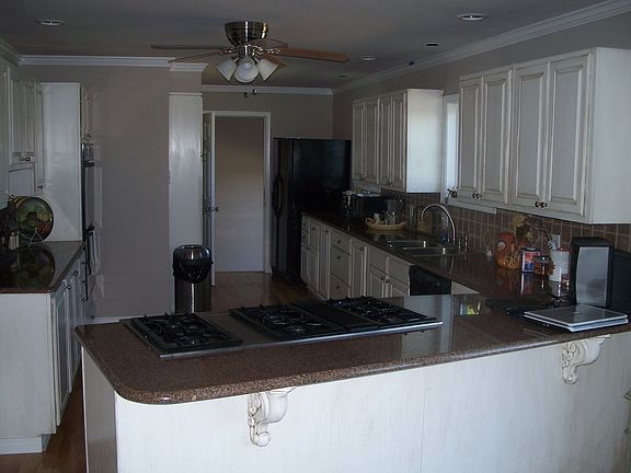 Remodeled kitchen with granite countertops and jenn aire range