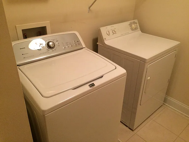 Separate laundry room located upstairs between the 2 upstairs bedrooms