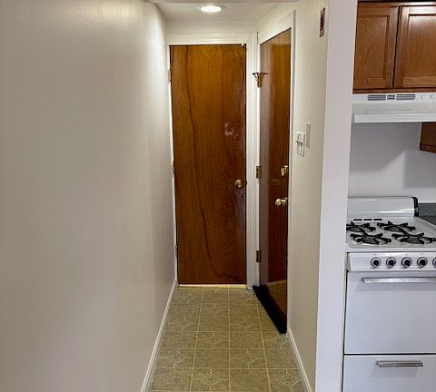 Convenient closet as you enter behind entrance door leads to large kitchen