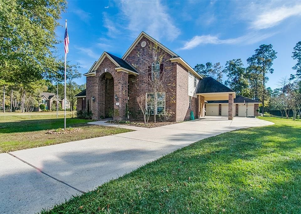 Patio area overlooks the sparkling pool with slide.