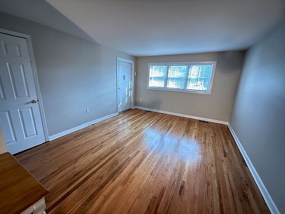 (Living Room) Hardwood Floors, lots of natural light. Interior & Exterior entrances. Closet.