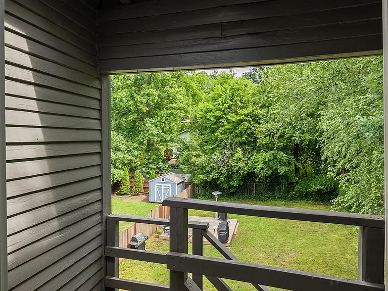 Back of apartment, stairs lead down to laundry room and backyard
