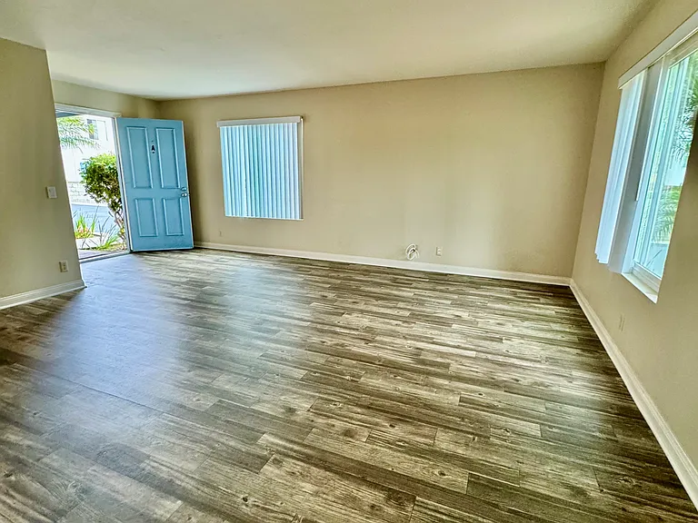 View from kitchen into living room and front door