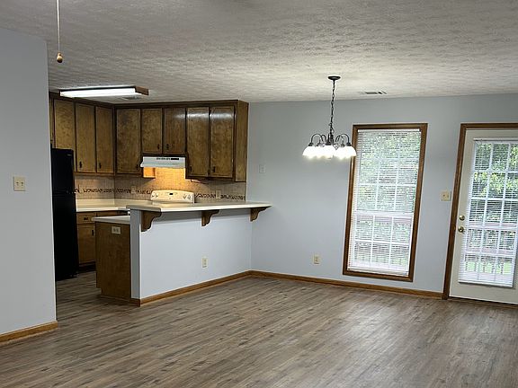 Dining room and kitchen; back door leading to deck