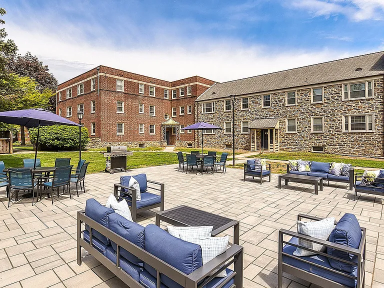 Patio area with seating and grill