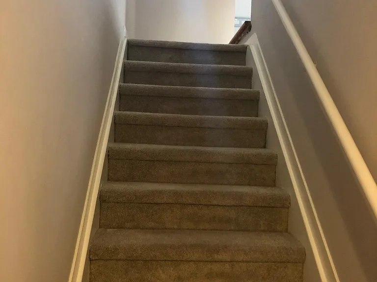 Stairs to upper level loft and 2 Bedrooms