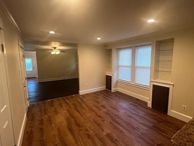 Dining area (built in shelving, vinyl plank floor)