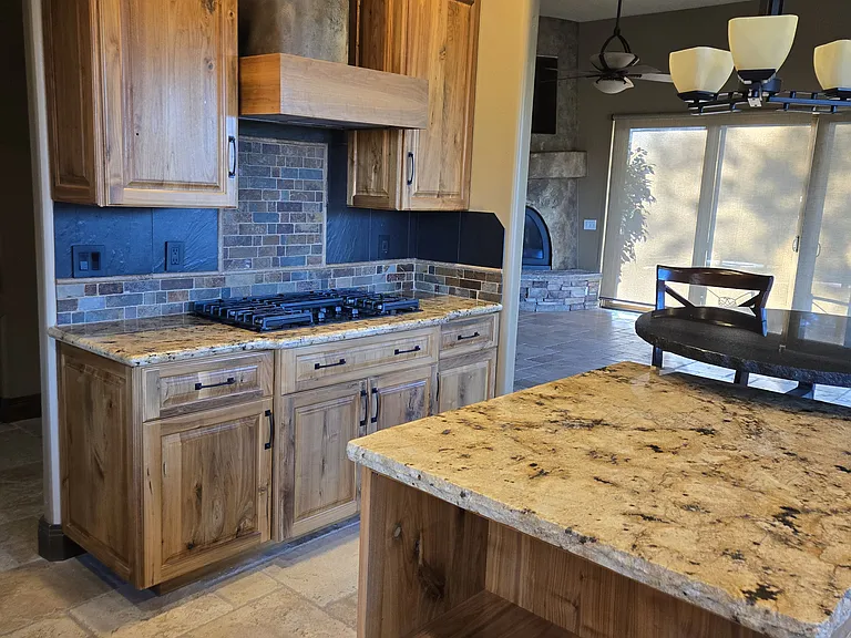 kitchen view with stove and custom hood