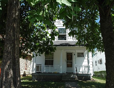 Nice treed street with parking at street and rear plus small drive.
