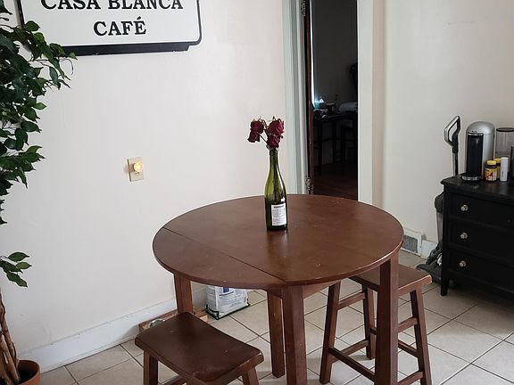 Dining area located in the kitchen. Doorway leads to Bedroom and Bath.