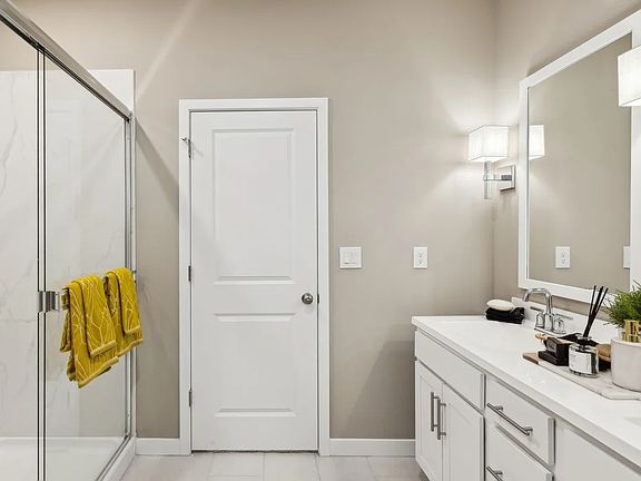 Primary bath with glass shower enclosure