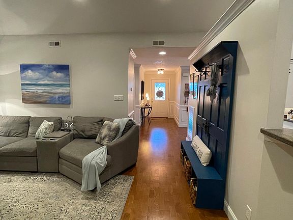 View from back toward Master bedroom entrance to he front door. Open kitchen plan to be apart of living room area. Cathedral ceilings