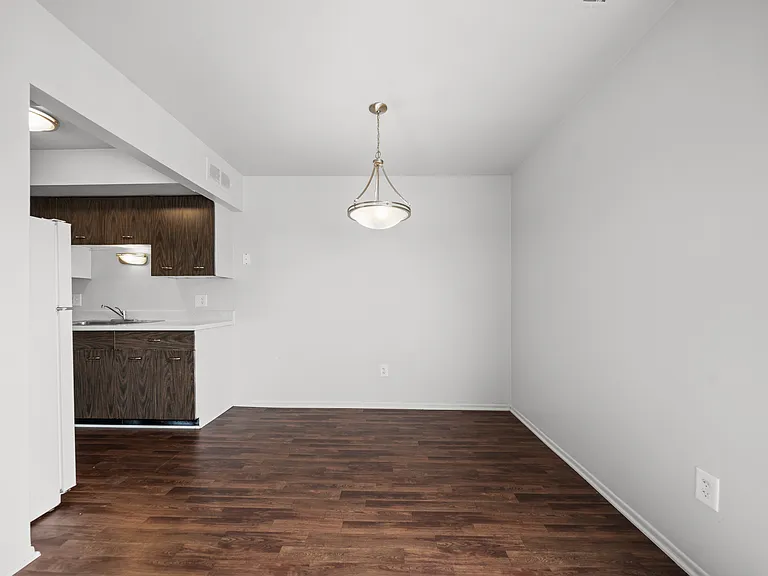 Spacious dining room area ta Knottingham Apartments in Clinton Township, MI.