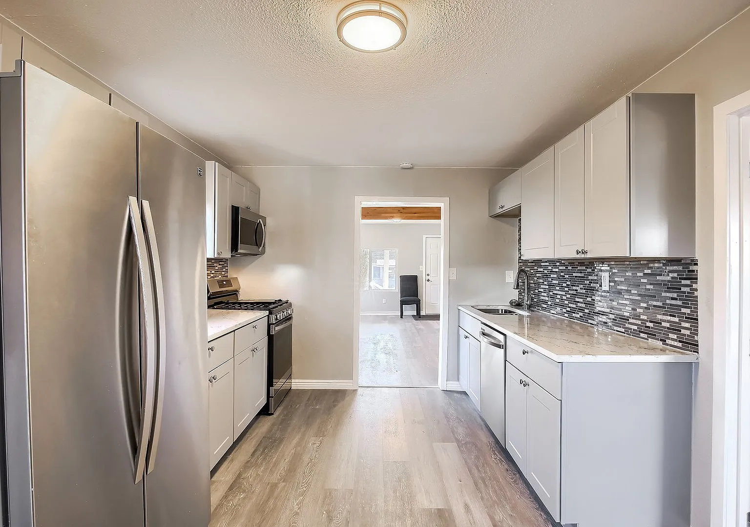 Updated 2BR Home with Modern Kitchen & Spacious Backyard — Photo 2