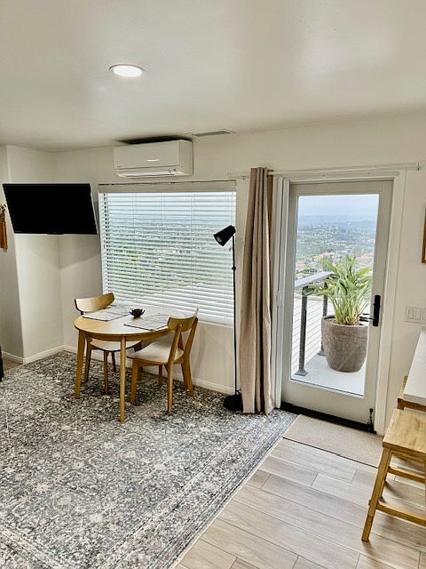 Blinds and blackout curtain ensure a good sleep no matter the time of day, while the retractable screen and AC/heat pump provide comfortable temps