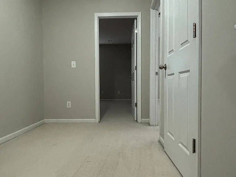 As you walk up to second floor you see the first bedroom door.