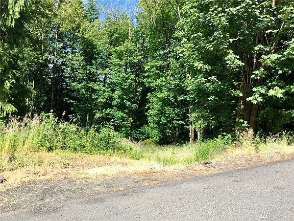Excavated gradual sloped driveway starting at the left of the photo