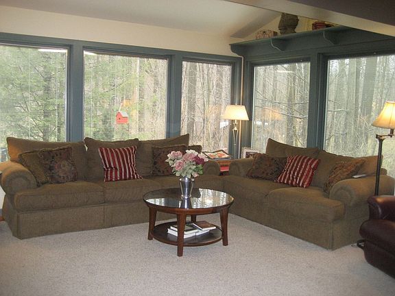 Walls of windows overlooking backyard