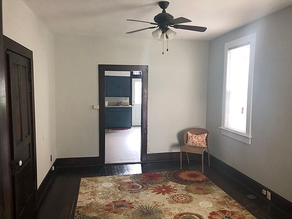 Livingroom. Door on left got to extra living space PLUS 2nd bathroom. Ktichen straight ahead.