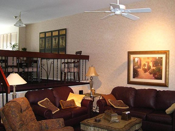 Living Room with Vaulted Ceilings and trach lighting