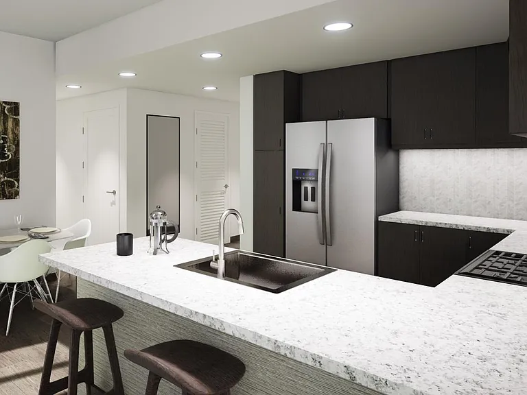 Light, bright and spacious kitchen with granite countertops, gourmet stainless steel appliances, and a breakfast bar.