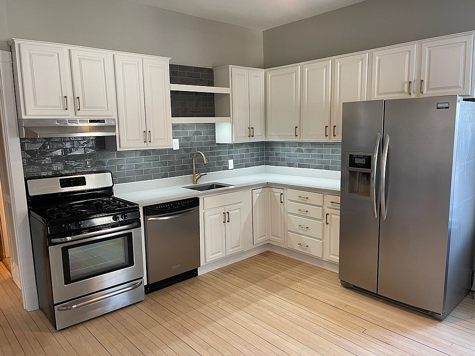 Updated kitchen with quartz countertops, ice maker fridge.