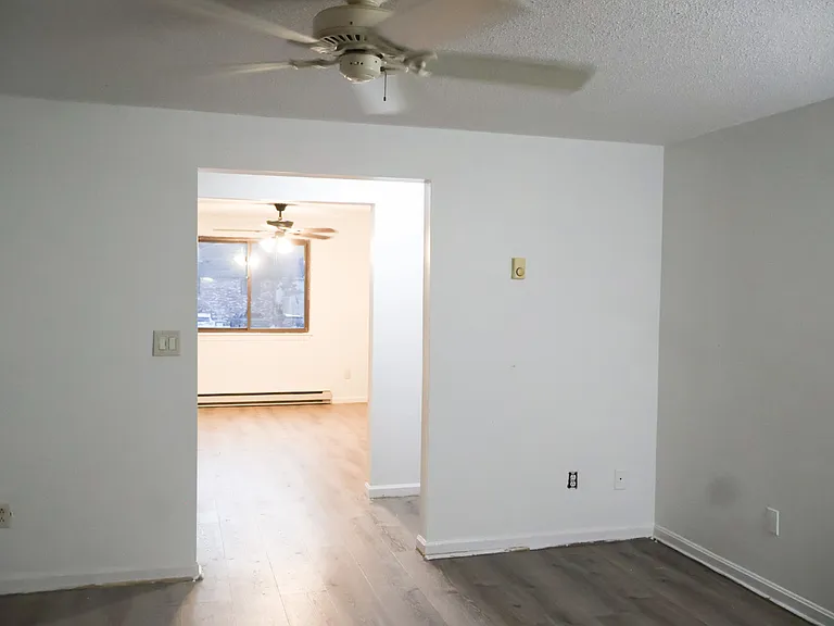 Living Room / Living Space _ Renovations Nearing Completion. New Baseboards Will Be Installed and the Fire Escape Door Will Be Freshly Painted.