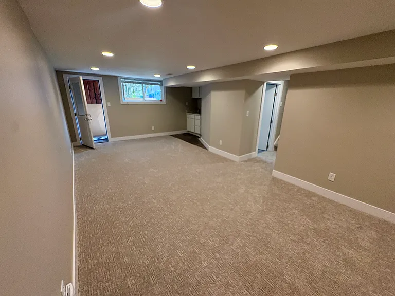 Large basement space with new carpet. Has independent access from outside.