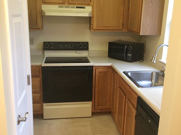 Kitchen View showing Dishwasher, Microwave, Sink, Cabinets &