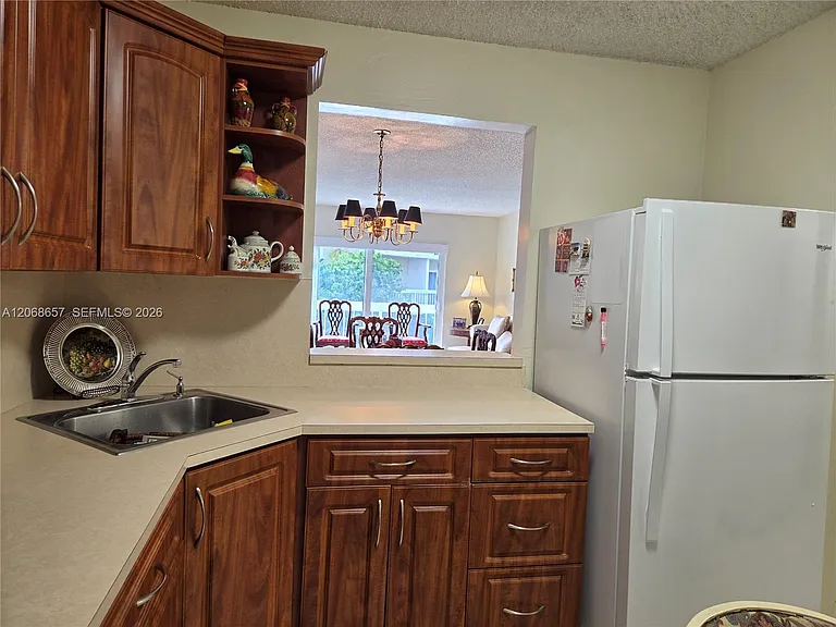 7707 Camino Real #B-209 — Photo 12
