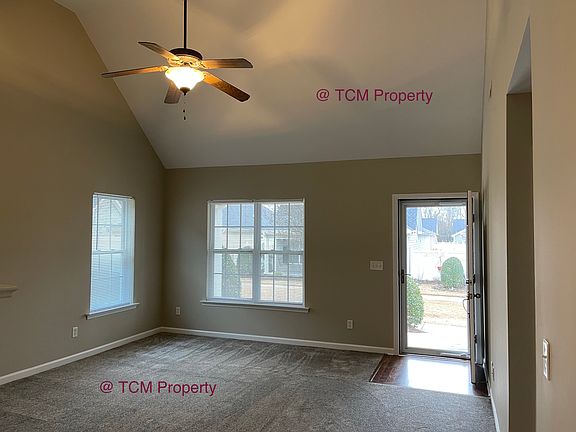 Great Room with lots of light and propane gas fireplace