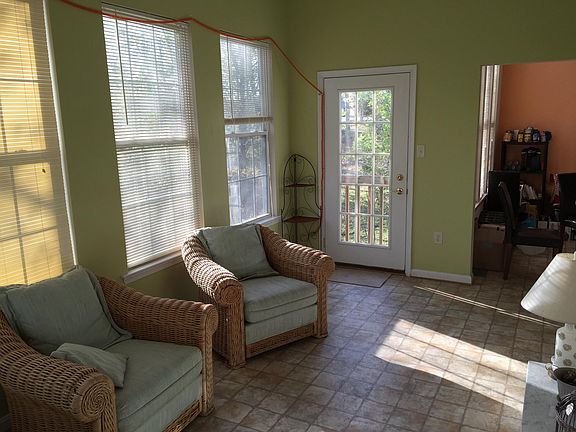 Sunroom in the back of the house viewing the forest in the back