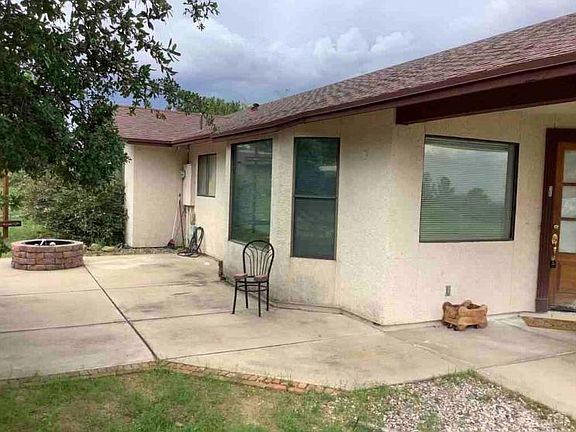 The mountainside of the house.