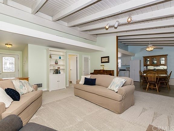 Front door on the far left; door to front bedroom in center; then dining and kitchen on the right.