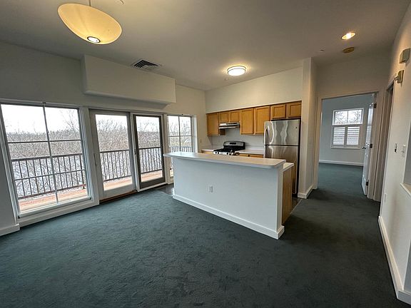 This photo highlights the hallway from the public living area to the primary bedroom.