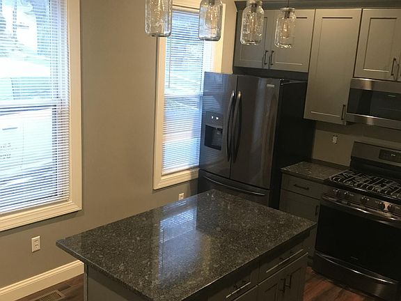 New granite countertops, custom pendant lighting, and new bl