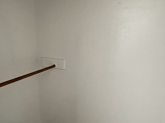 Another view of large walk-in closet.