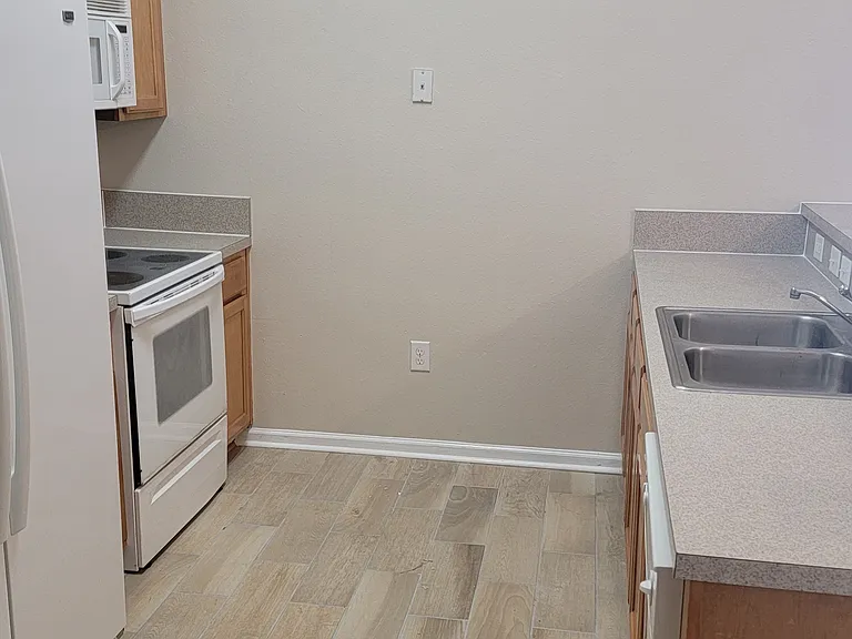 Kitchen with Dishwasher, Stove, Microwave, Garbage disposal and Fridge