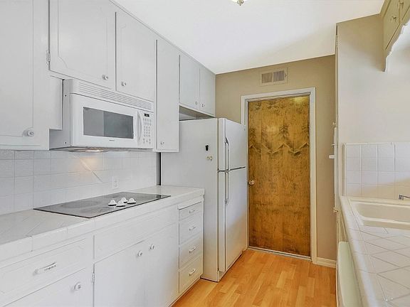 Newer appliances are found in this cheerful kitchen.