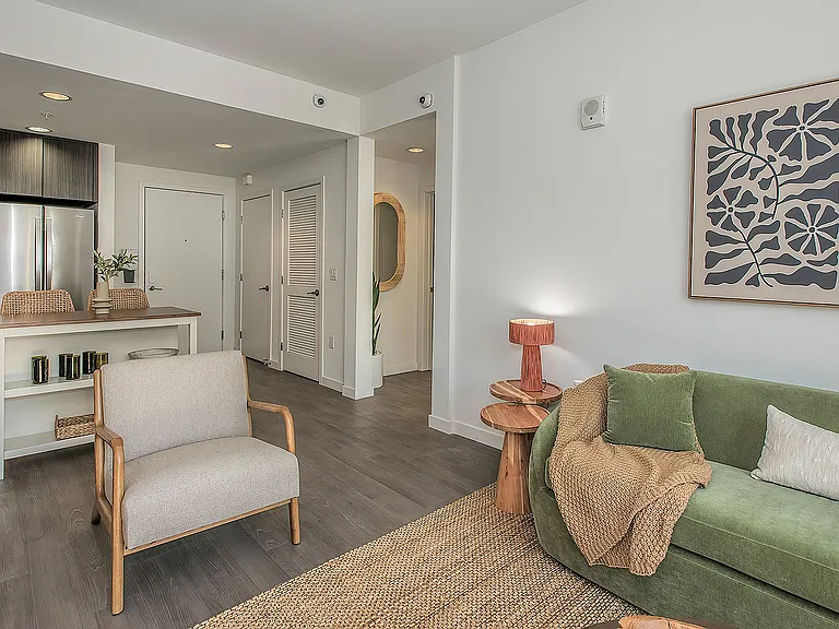 Contemporary living room with open layout, modern furnishings, and natural light.