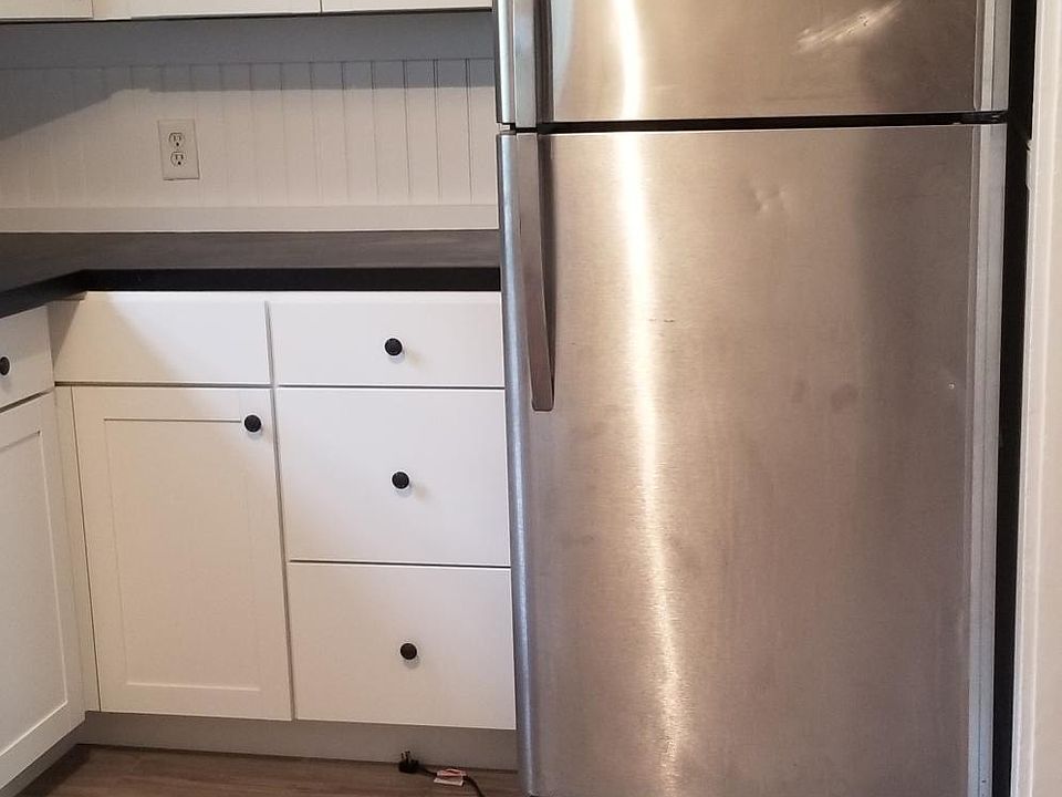 Kitchen with refrigerator