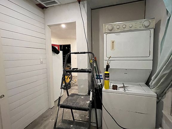 Large pantry/laundry room off kitchen with yard access
