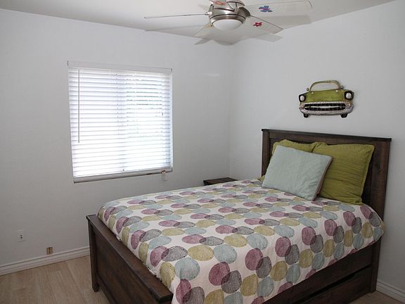 bedroom with double bed and storage bins underneath the bed