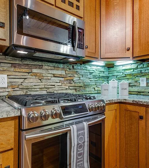 Gas stove and built-in microwave oven.