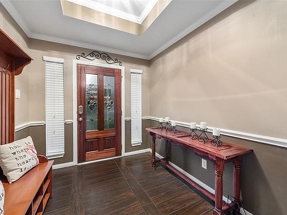 Warm Entry with coffered ceilings